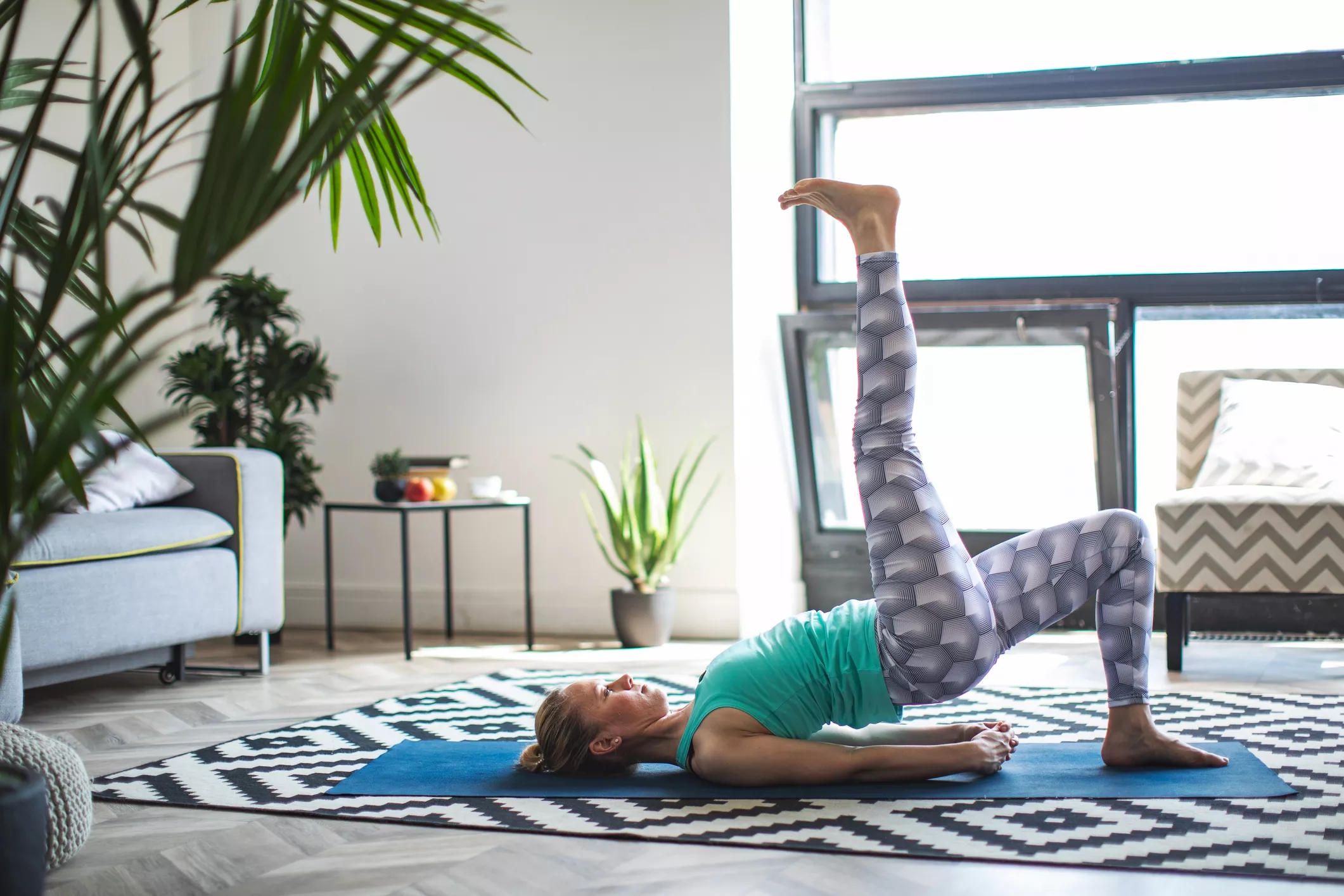 Woman doing yoga stretch at home